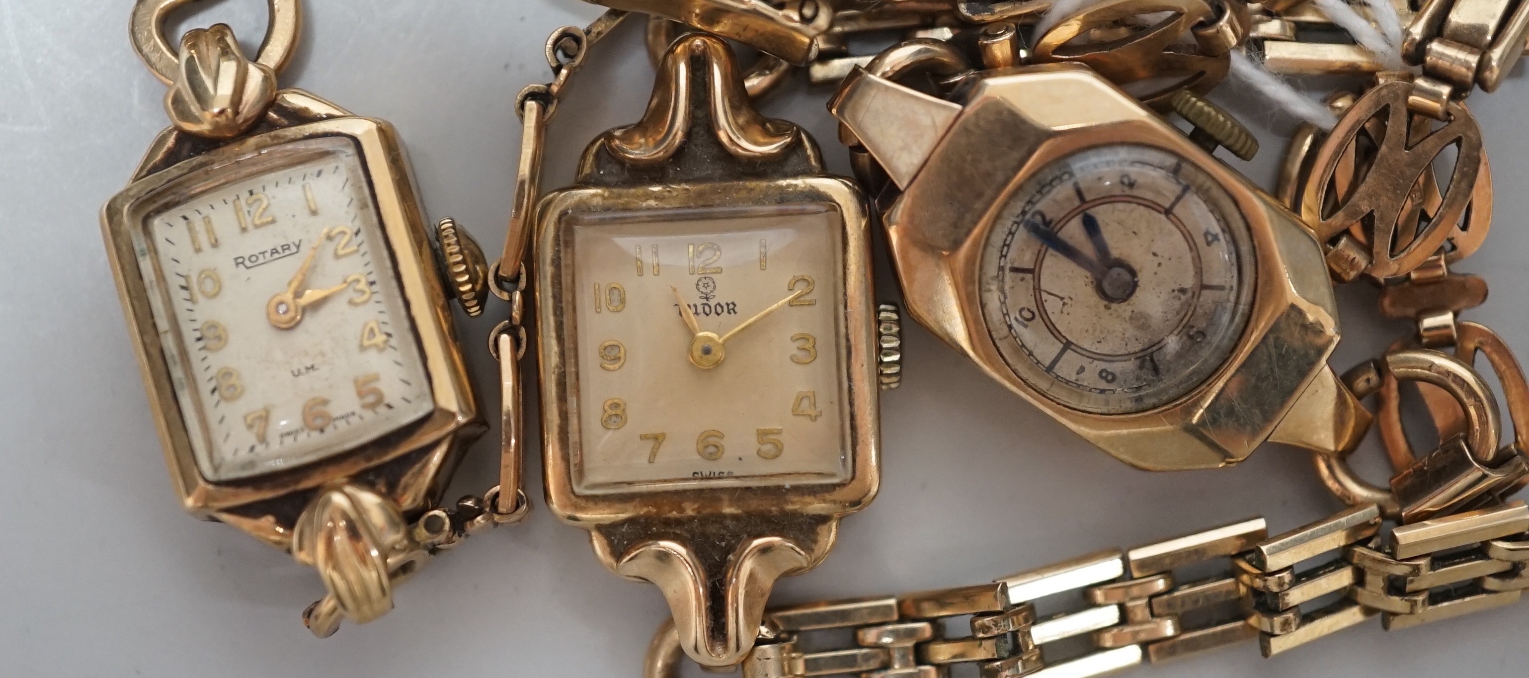 Two lady's 9ct gold manual wind wrist watches, including Rotary, on 9ct gold bracelets, gross weight 26.2 grams and a lady's 9ct gold Tudor manual wind wrist watch, on a steel and gold plated bracelet.